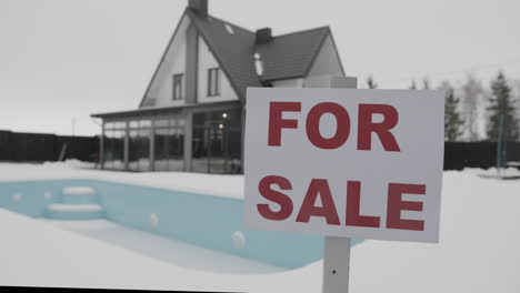 for sale banner on a house