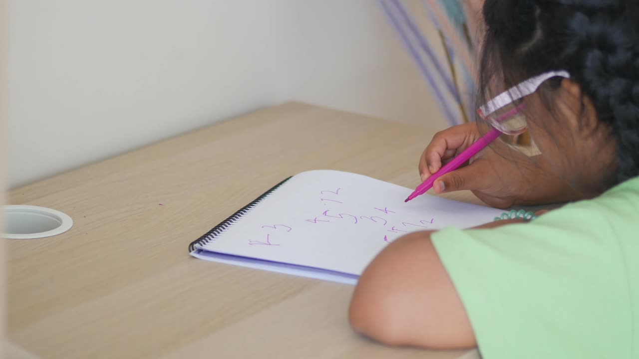 Child doing homework at a desk