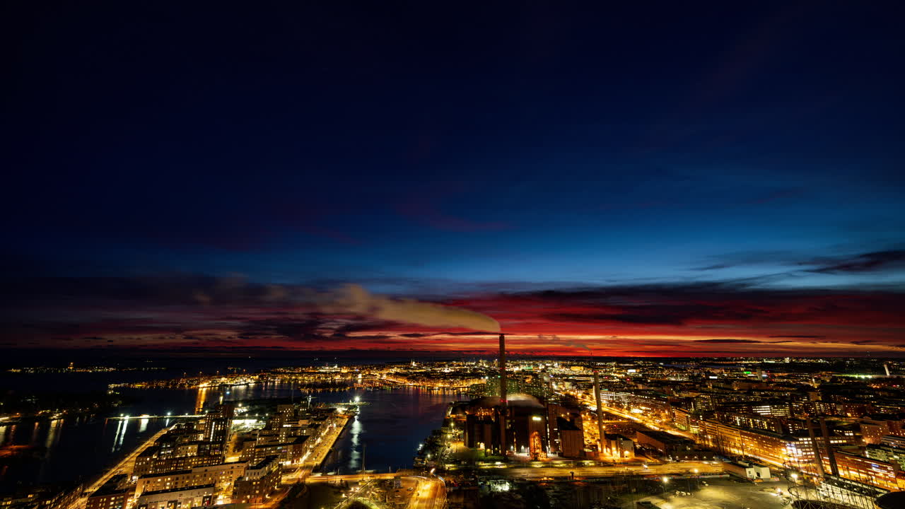 Time lapse of a vivid sunset turning into night above the Helsinki skyline
