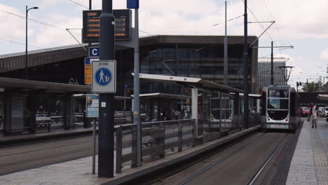 Slowmotion-hand-held-shot-of-a-tram-waiting-at-the-depot-in-downtown-Rotterdam