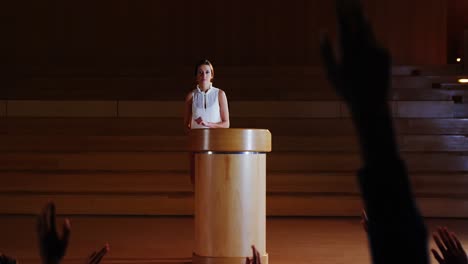 female business executive giving a speech