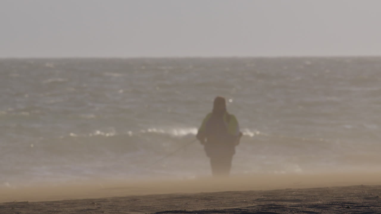 Fishing on a Windy Beach