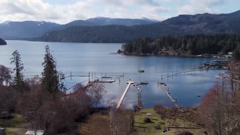 drone shot of lake ,mountains and forest in bc canada vancouver island