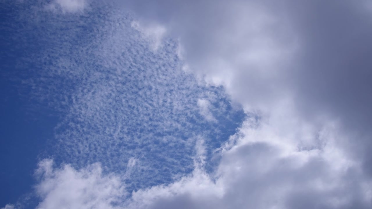 White clouds on a blue sky background