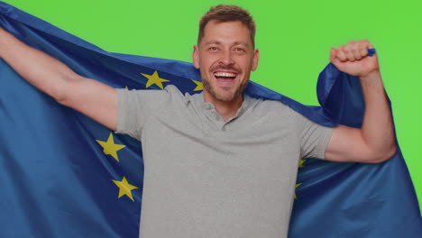 man waving european union flag, smiling, cheering democratic laws, human rights freedoms in europe