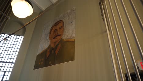 Poster-of-Joseph-Stalin-on-a-prison-wall