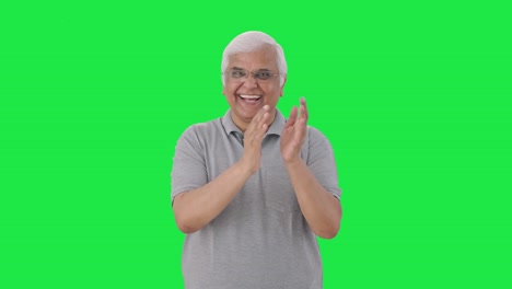 Happy-Indian-old-man-clapping-and-appreciating-Green-screen