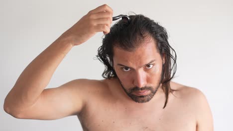 Man Using Dermaroller for Hair Loss Treatment
