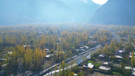 skardu city autumn aerial tracking forward