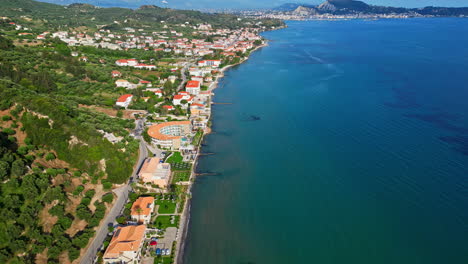 iconic tropical coastline township with mountains, aerial drone view