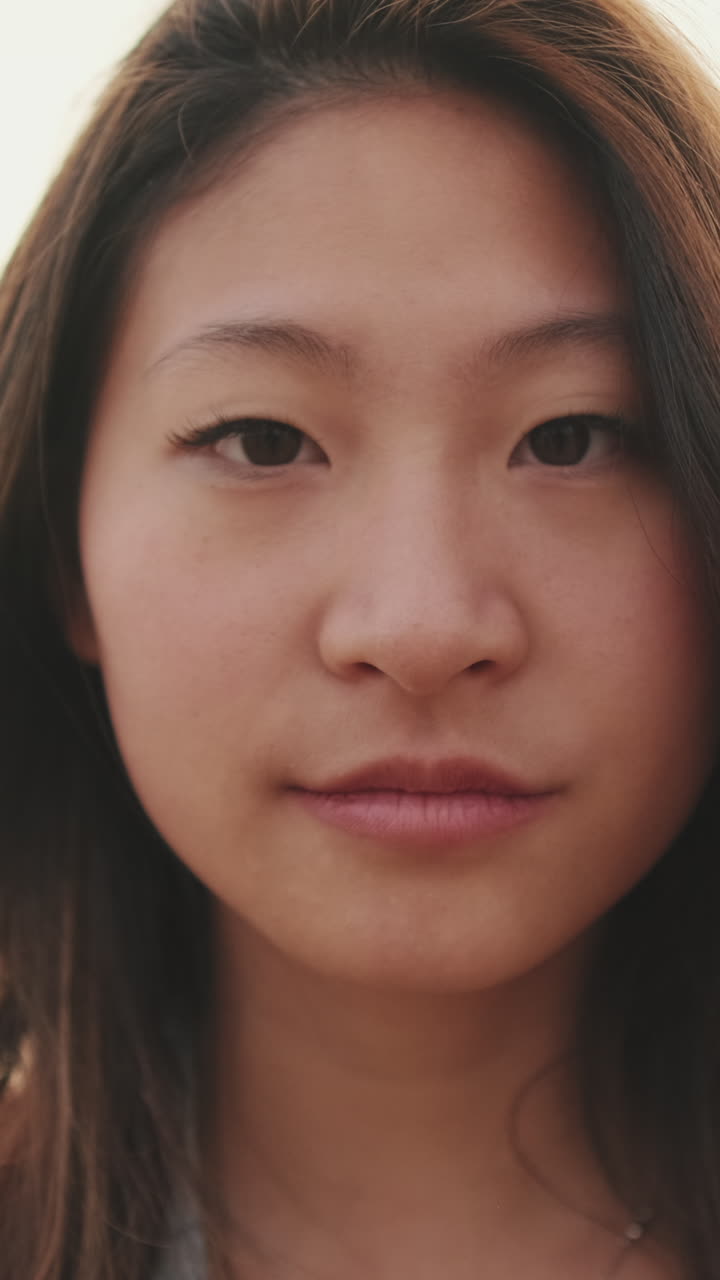 Close-up portrait of a young Asian woman