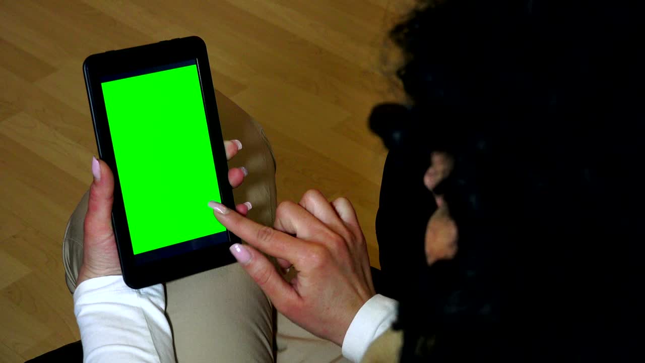Green screen hands using digital tablet touchscreen device, holding tablet screen touchpad woman, UHD stock video alpha luma matte included