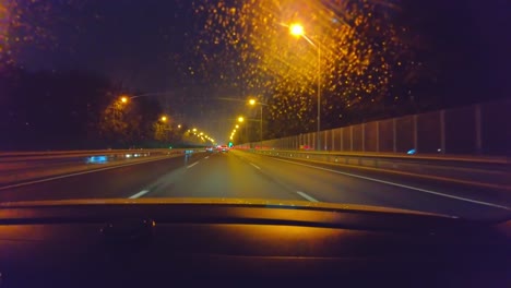 driving on a rainy beijing highway at night, dashboard view, lights reflected on wet surface