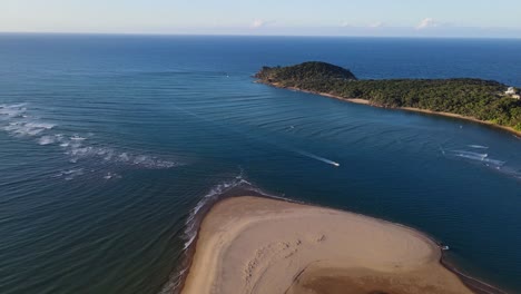 Aerial-View-Of-Sailboats-Sailing-At-Coral-Sea-Near-1770-Camping-Ground-In-QLD,-Australia