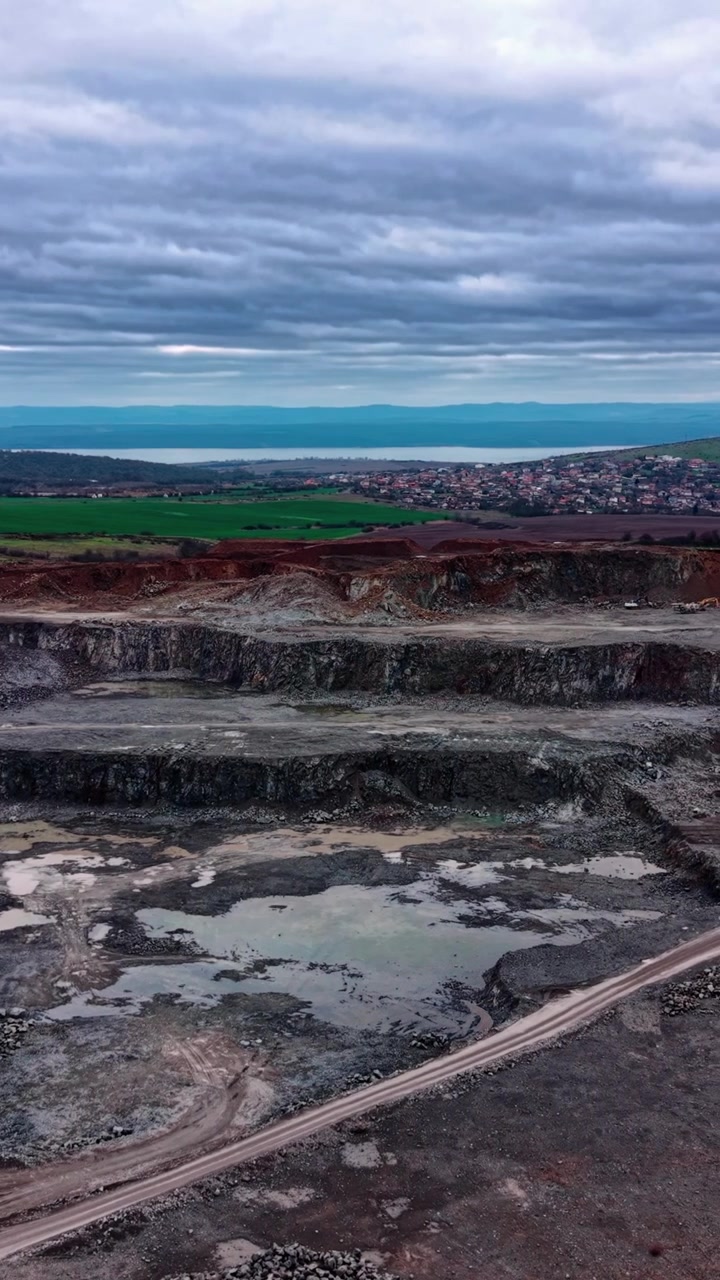Aerial View of an Open Pit Stone Quarry Under Cloudy Sky