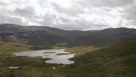 Drone-shot-of-Norway-remote-rocky-landscape-with-lakes,-forests-and-rivers