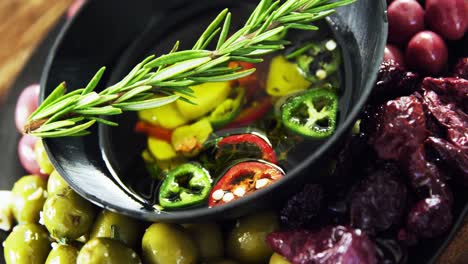 Olives,-rosemary-and-chopped-pepper-in-olive-oil