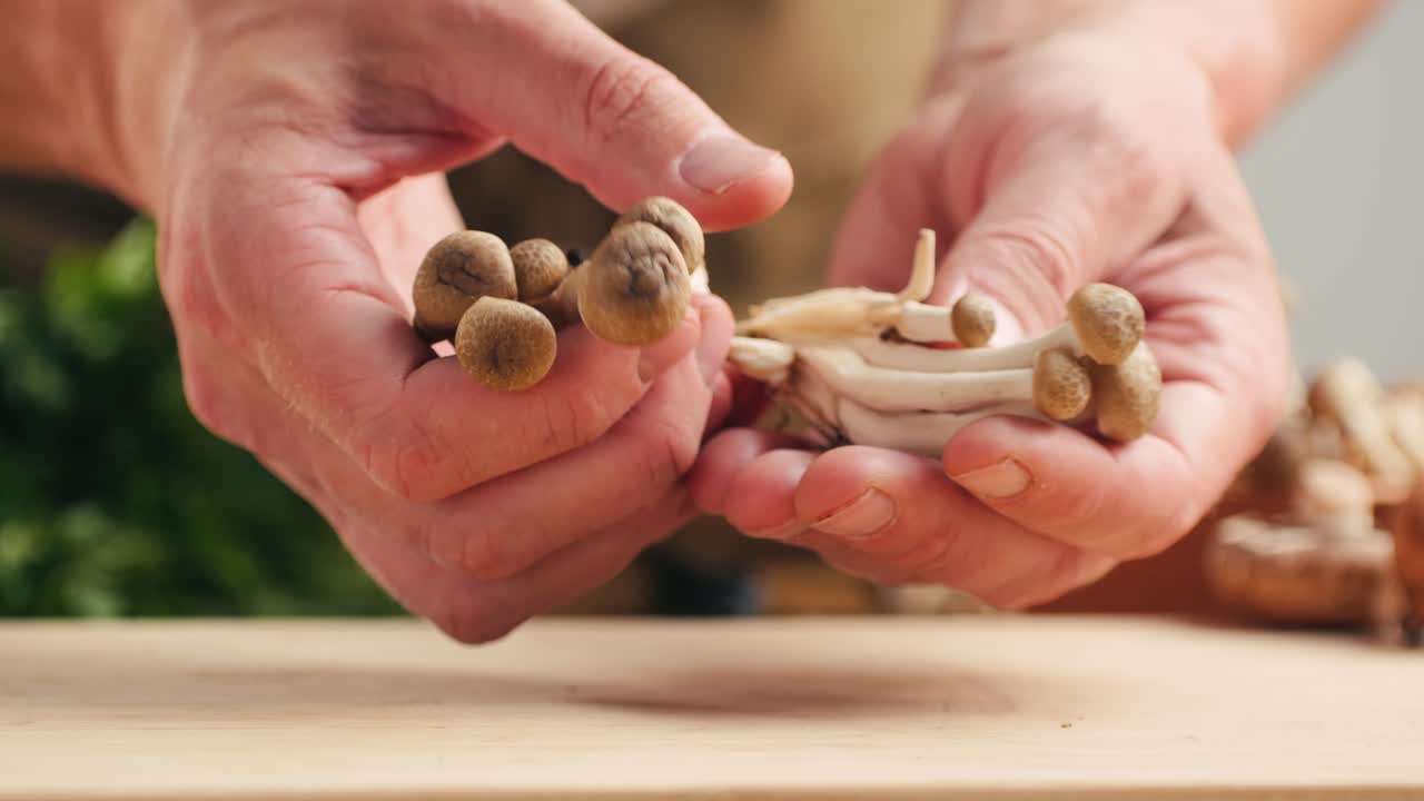 Chef preparing small brown mushrooms