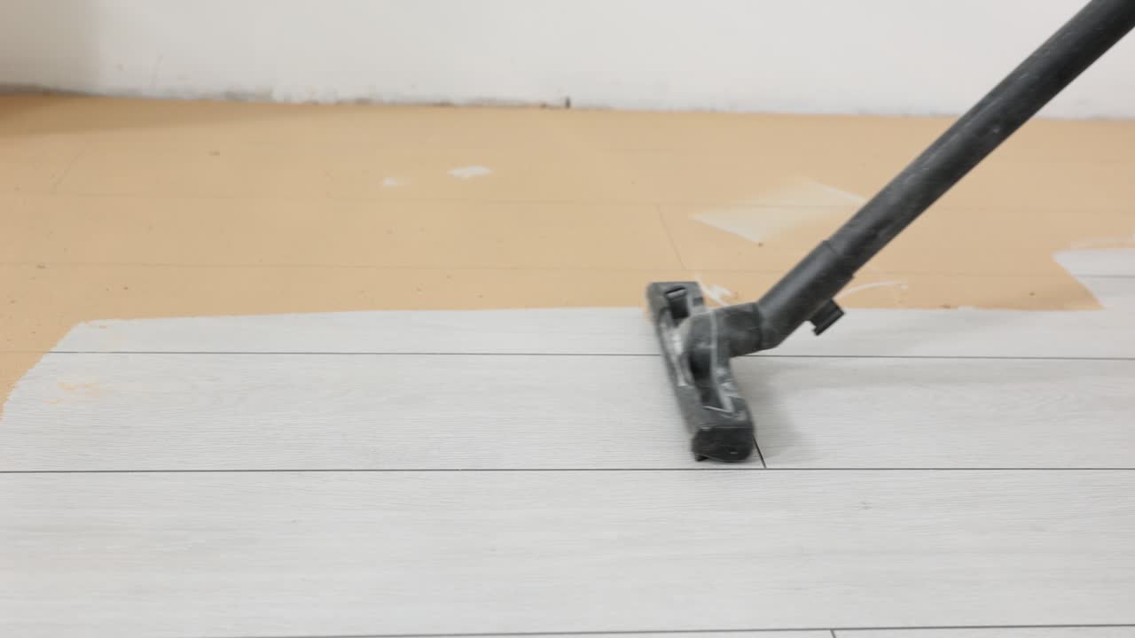 Vacuum Cleaner Cleaning a Floor During Renovation