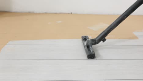 vacuum cleaner cleaning a floor during renovation