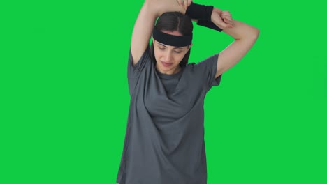 happy indian girl doing arm exercise green screen