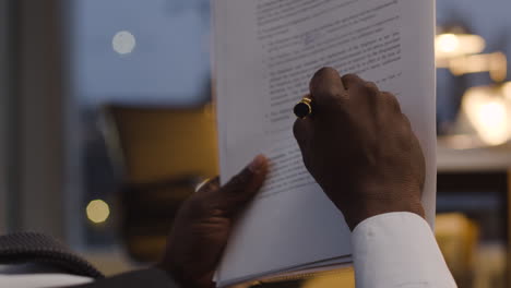 closeup of man reading contract