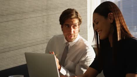 Front-view-of-young-Caucasian-office-executives-working-at-desk-in-a-modern-office-4k