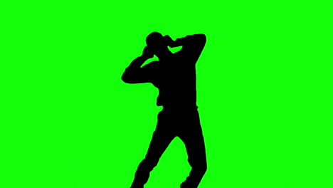 silhouette of a man jumping and listening to music on green screen