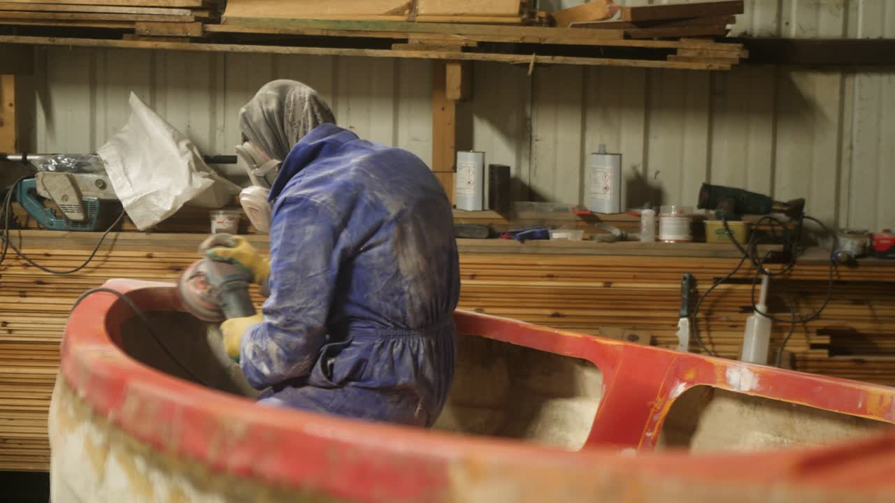 Sanding gunwale and transom of fiberglass fishing boat