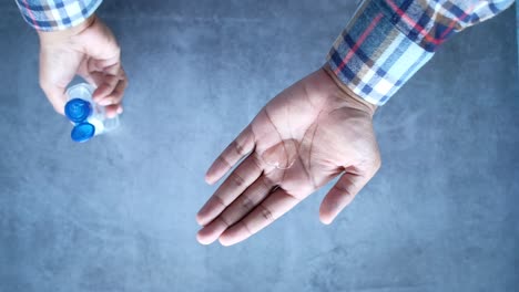 washing hands with hand sanitizer