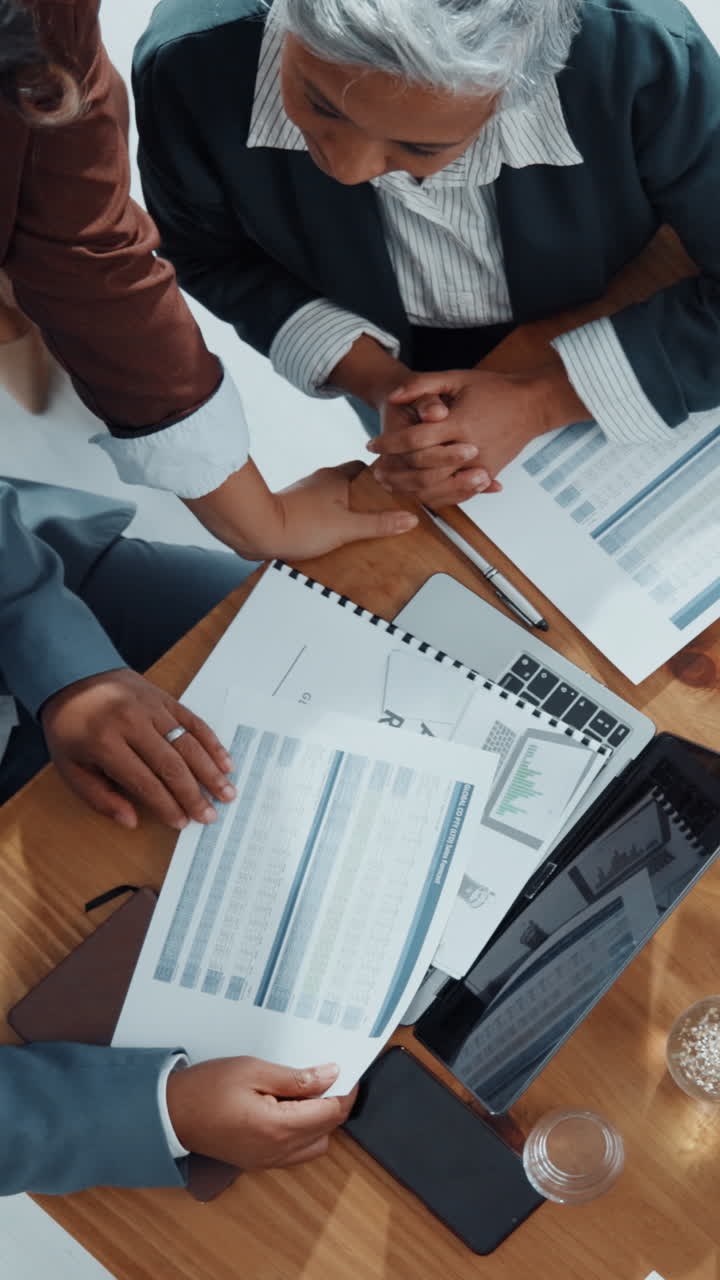 Business People Discussing Financial Documents in an Office Meeting
