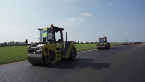 road roller working on highway paving project