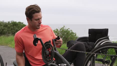 disabled man tired after riding a recumbent bicycle