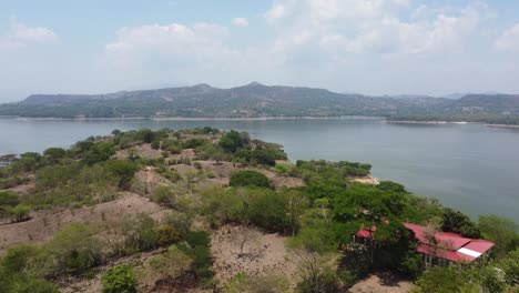 Rugged-mountain-shoreline-of-Cerron-Grande-Reservoir-lake,-El-Salvador