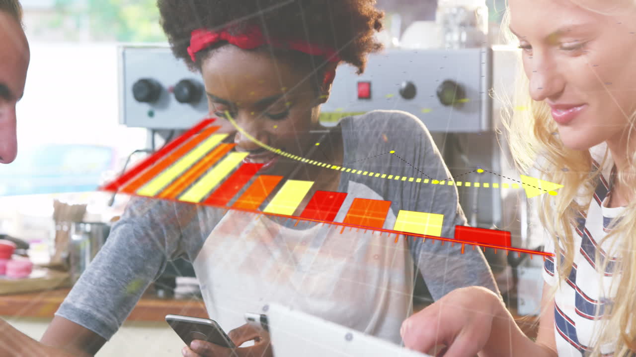 Diverse team uses tech to animate data at a cafe, showcasing business tech.