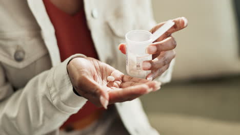 woman pouring pills into her hand