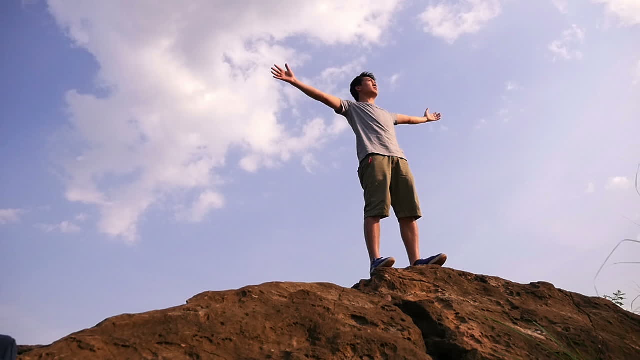 Man Celebrating on Mountaintop