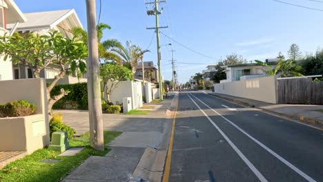 progression of a suburban street scene with pedestrians and vehicles