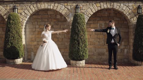 newlyweds. caucasian groom with bride in the park. wedding couple. happy family