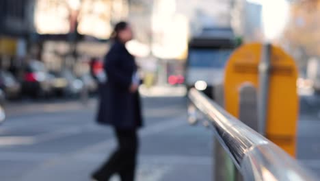 pedestrians crossing street, bus approaching