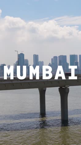 Vertikale-Video-Drohnenaufnahme-Der-Skyline-Von-Mumbai-Mit-Der-Bandra-Worli-Sea-Link-Brücke,-überlagert-Mit-Einer-Animierten-Grafik,-Die-Mumbai-Darstellt