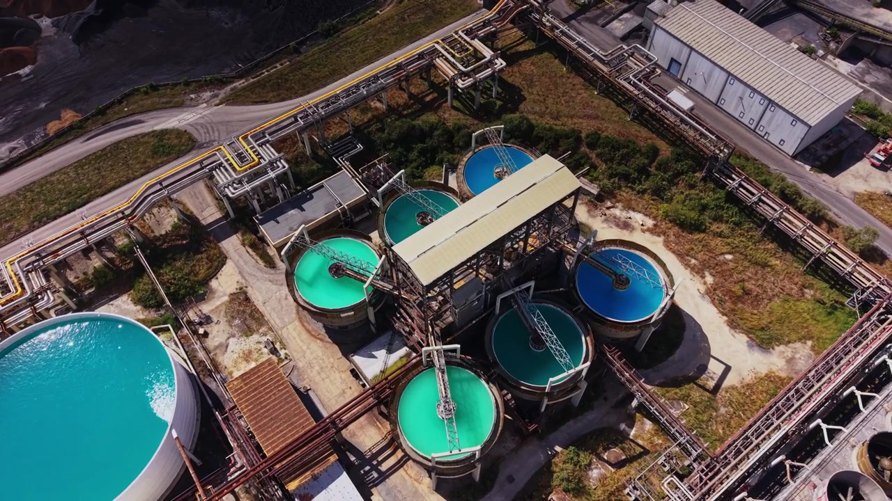 Water treatment facility in operation with circular tanks and machinery