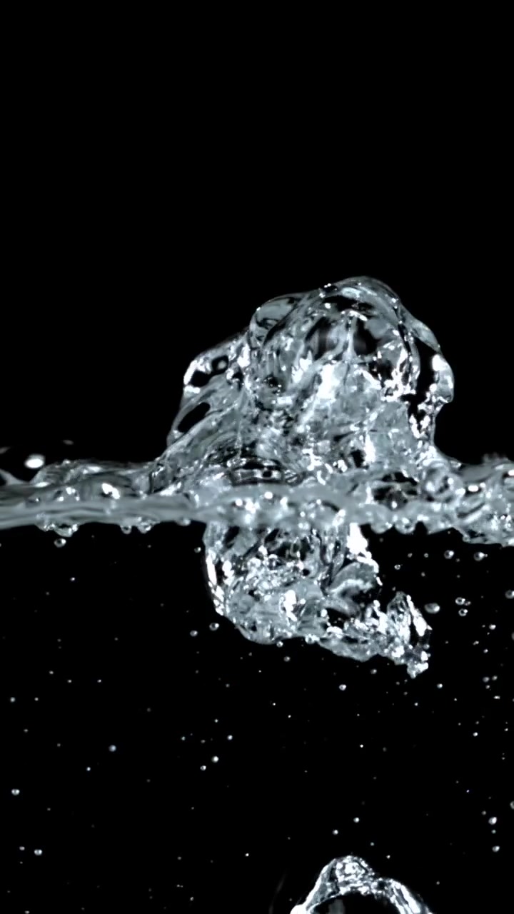 Slow Motion Water Bubbles Rising and Bursting on Black Background