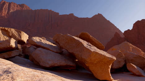 desert landscape with red rock formations and boulders
