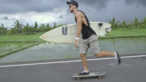 man skateboarding along picturesque road in tropics