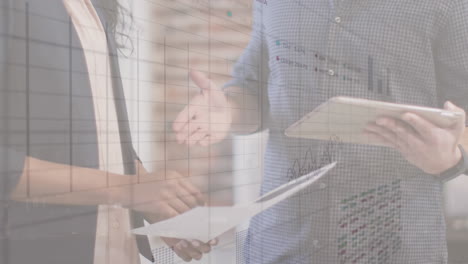 animation of statistical data processing over mid section of man and woman shaking hands at office