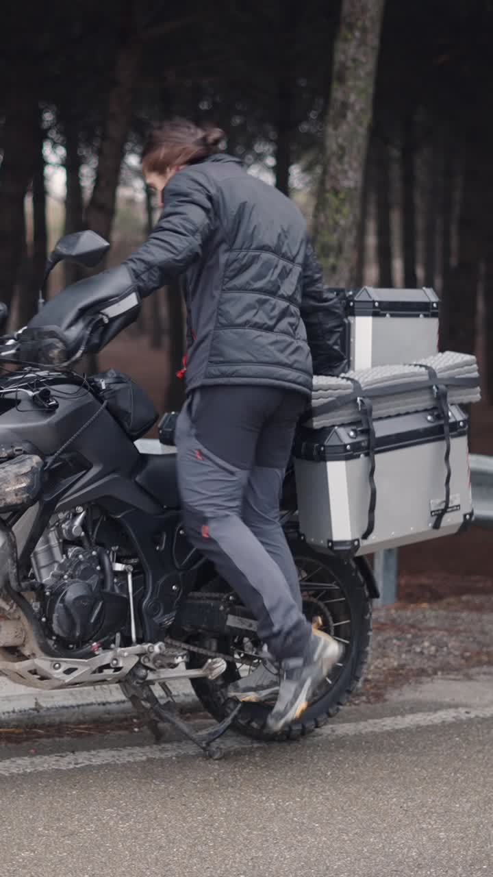 Man with motorcycle on a road