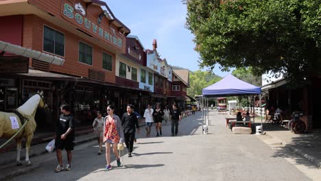 crowds navigating through a lively outdoor market.