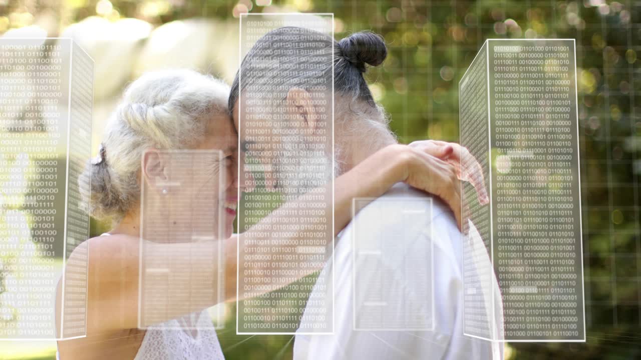 Senior couple pressing foreheads in garden, HUD panels sliding, initiating hug showing health tech