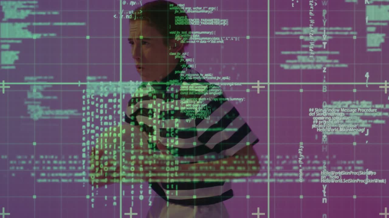 Adult woman raising hands, inspecting floating green code grid flickering into view in tech studio